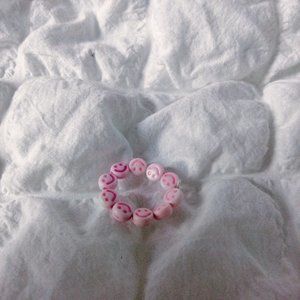 Pink smiley face ring